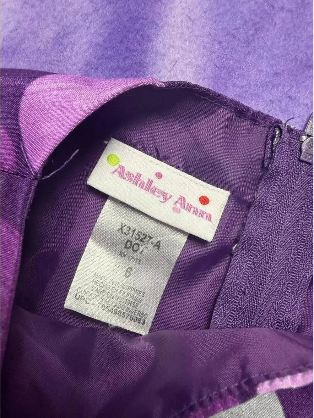 Ashley Ann purple and grey polka dot dress with a bow in the back